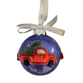 Boule de Noël camions rouges en peau de phoque